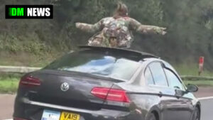 Woman Spotted Standing Through Sunroof of Private Hire Vehicle on UK Motorway